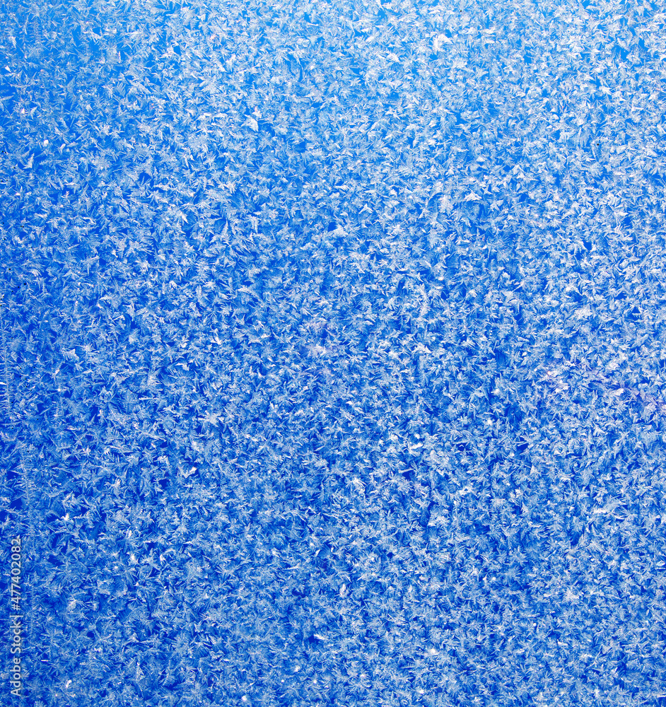 Blue pattern on glass abstract natural background.