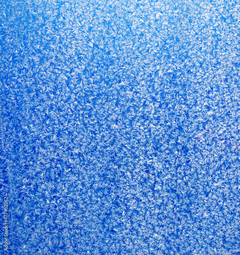 Blue pattern on glass abstract natural background.