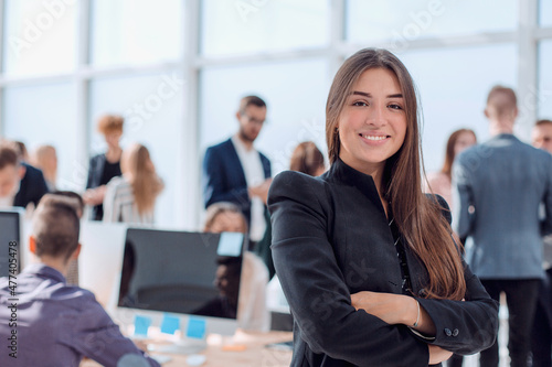 confident young business woman on the background of the office photo