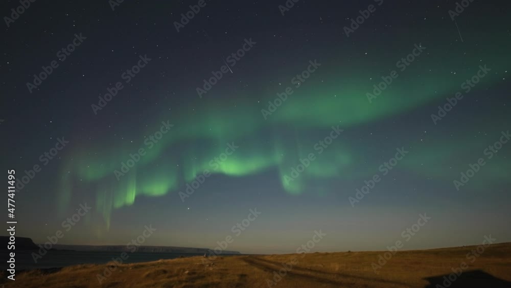 The beautiful dance of the northern lights in the starry night sky above the desolate tundra. The beautiful dance of the northern lights in the starry night sky above the desolate tundra.