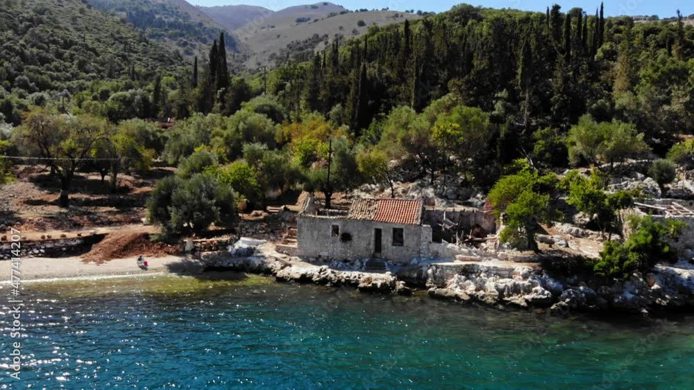 Historic Structures In Agia Sofia Beach Shoreline In Mediterranean Sea, Kefalonia Island, Greece. Aerial Pullback Historic Structures In Agia Sofia Beach Shoreline In Mediterranean Sea, Kefalonia Island, Greece. Aerial Pullback