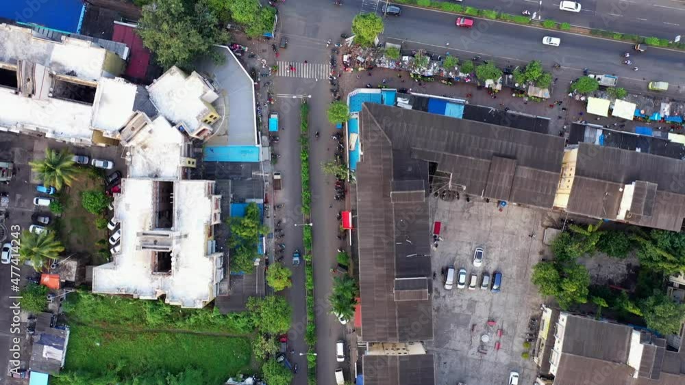 Top down view of buildings and suburban streets in Vasai, Mumbai, India - aerial drone shot Top down view of buildings and suburban streets in Vasai, Mumbai, India - aerial drone shot