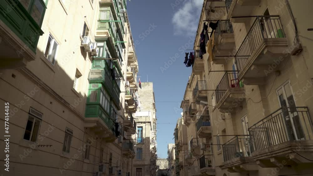 Casual Walk in Valletta City with Buildings and Very Narrow Street Casual Walk in Valletta City with Buildings and Very Narrow Street