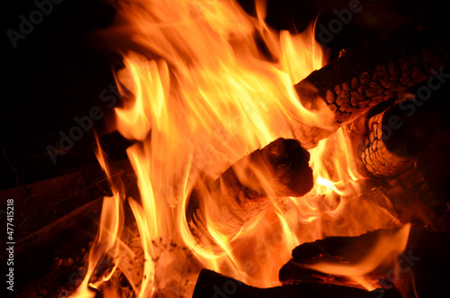 logs burning on an open fire, relaxing way to keep warm in the winter 