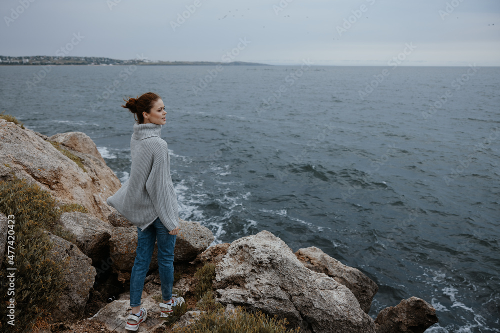 pretty woman sweaters cloudy sea admiring nature Relaxation concept