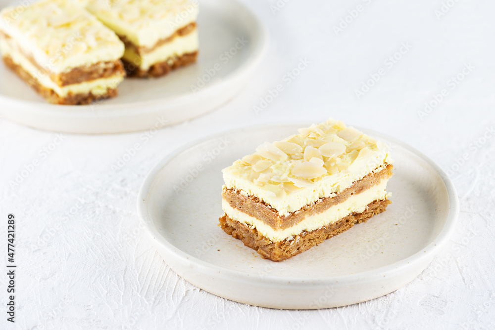 Homemade sliced lemon cake with almonds on a plate. Sugar, gluten and lactose free and vegan. Homemade sliced lemon cake with almonds on a plate. Sugar, gluten and lactose free and vegan.