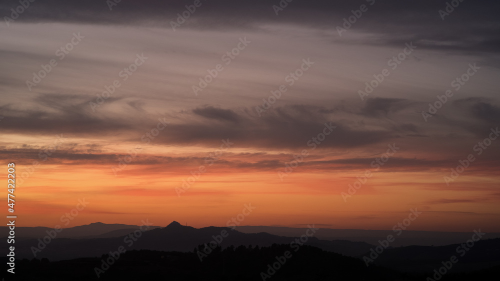Soft pastel colours in post sunset sky over valleys and rolling hills of Valenciana region Spain