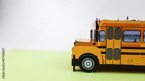 an image of a yellow school bus on a green background. I'm going to school soon.