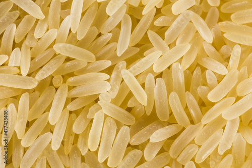 White and yellow rice grains close-up