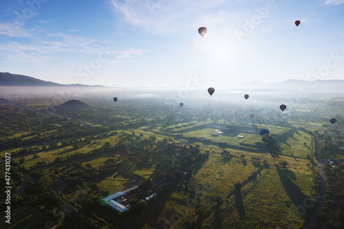 Hot Air Balloon Flight over Teotihuacan at sunrise in Mexico. View from the top.