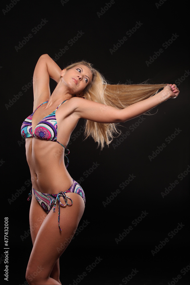 woman in underwear on black background woman in underwear on black background