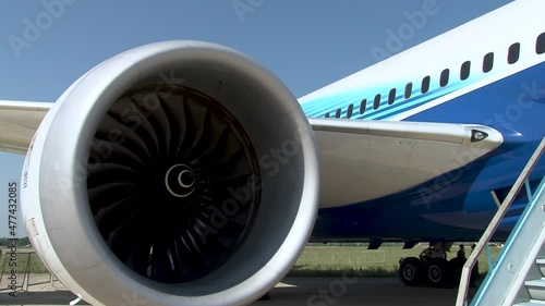 Close-up of rotating engine rotor under wing of American wide-body twin-engine jet airliner Boeing 787 Dreamliner. Close-up of wing and fuselage. Zhukovsky, Russia, August 16, 2011.

