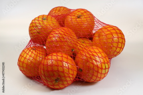 Mandarins in the red net