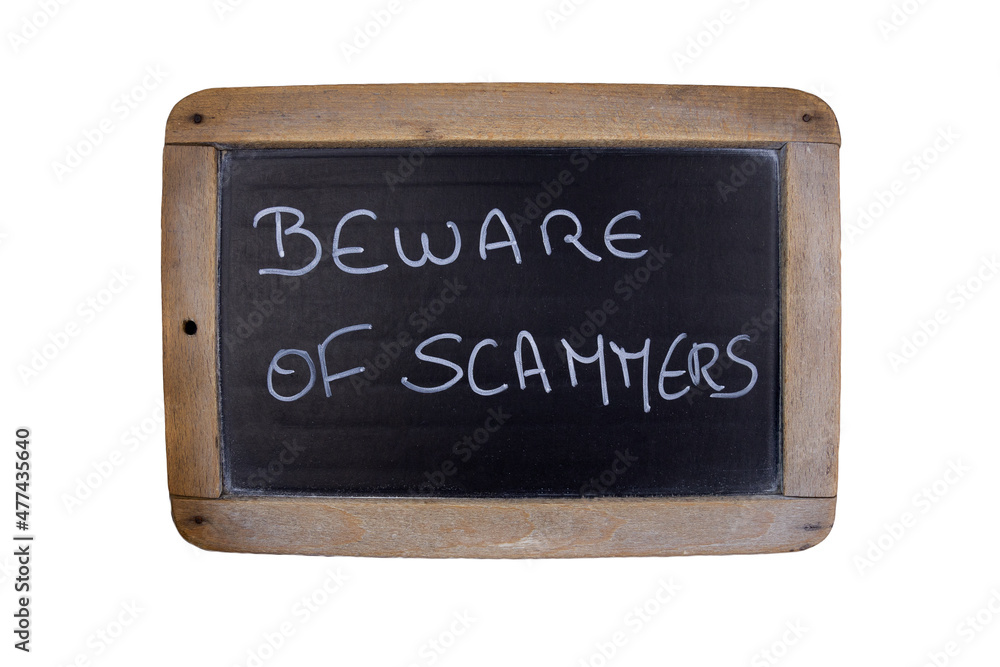 Obraz premium blackboard with text Beware of scammers and wooden frame, isolated on white background