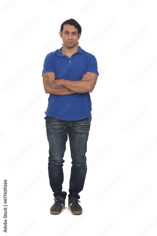 front view of a man with long hair and tattoo arms crossed on white background front view of a man with long hair and tattoo arms crossed on white background