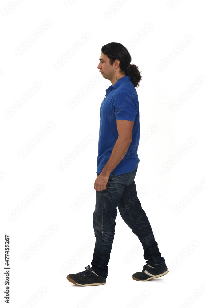 side view of a man dressed in casual clothes with tattoos on white background side view of a man dressed in casual clothes with tattoos on white background
