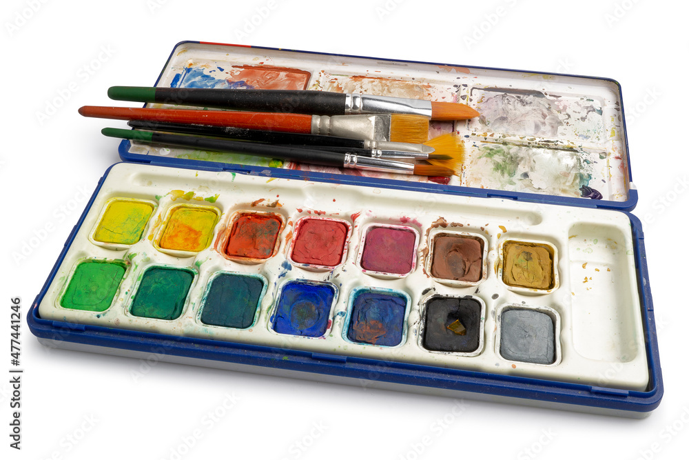 Watercolor paint set which has been used for years with old brushes suitable for painters and watercolor painting subjects isolated on white background. Clipping path
