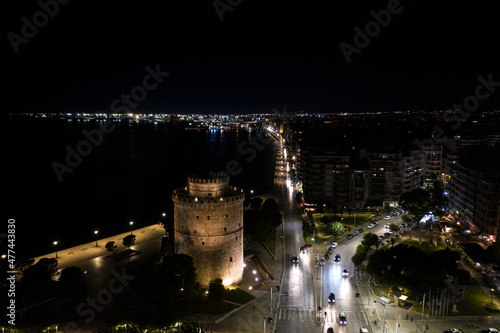 Fototapeta Naklejka Na Ścianę i Meble -  Aerial view of famous White Tower and the city of Thessaloniki at night.