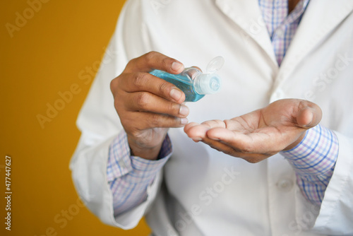 close up of doctor hand using sanitizer gel 