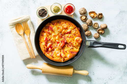 Pizza,Delicious pepperoni pizza and basil tomato cooking ingredients on black concrete background, top view of hot pepperoni pizza. With copy space for text lay flat, banner