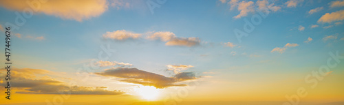 clouds and yellow sky,Sky background at sunset,Sky blue and orange light of the sun through the clouds in the sky