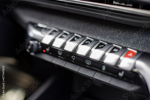 multimedia control console and climate in a modern car. close-up, selective focus, no people