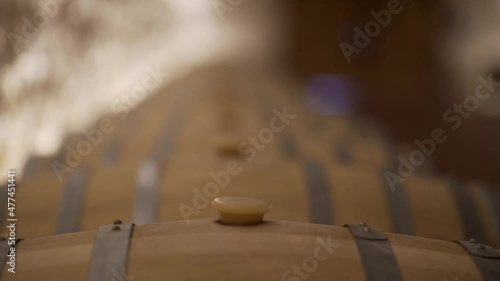 Barricas de madera con vino dentro una bodega  photo