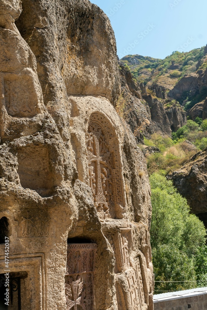 Naklejka premium Armenia, Geghard, September 2021. Religious symbols carved into the rock.
