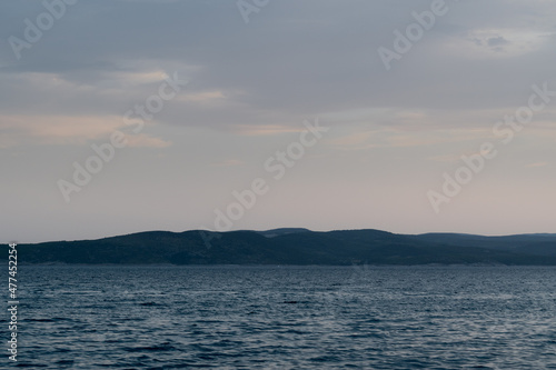 Seascape with wavy Adriatic sea and Brac island silhouette in Croatia at dusk © slobodan