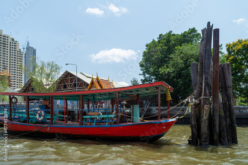 Ferry boat moored near Wat Thong Thammachat Pier on the Chao Phraya River. - Bangkok, Thailand.