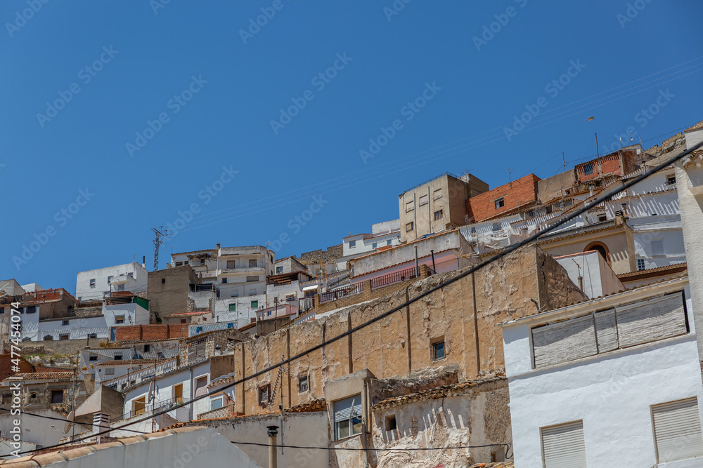 View of some typical houses of the town Alcala del Jucar in Albacete, Spain