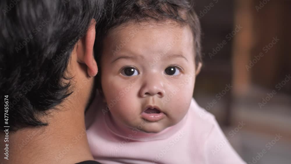 A happy little baby girl with beautiful eyes cute Indian baby girl baby with chubby cheeks. A