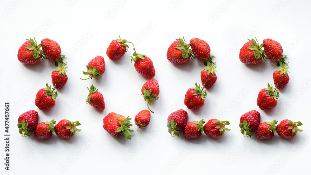 2022, contained in strawberries (New Year's card - concept)