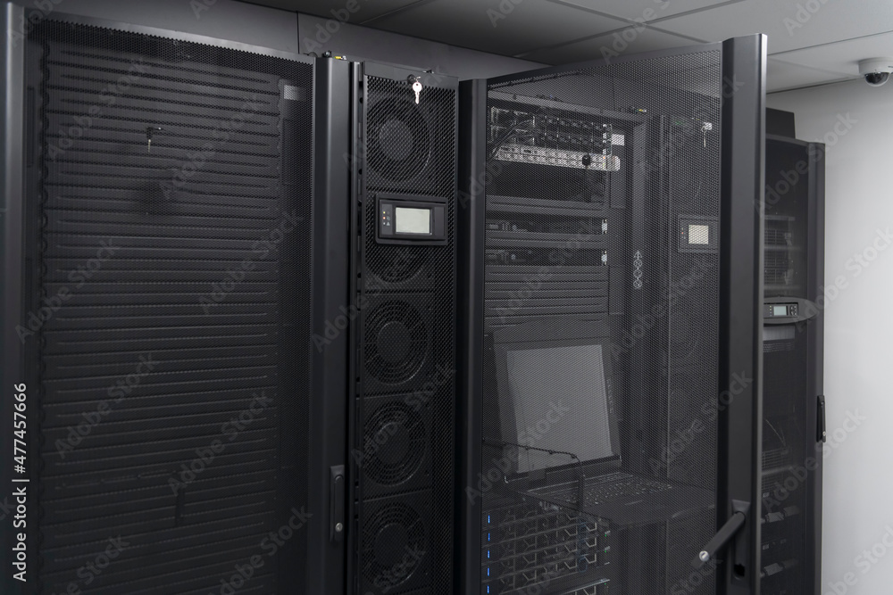 Data Center With Multiple Rows of Fully Operational Server Racks. Modern Telecommunications, Cloud Computing, Artificial Intelligence, Database, Supercomputer Technology Concept. Data Center With Multiple Rows of Fully Operational Server Racks. Modern Telecommunications, Cloud Computing, Artificial Intelligence, Database, Supercomputer Technology Concept.