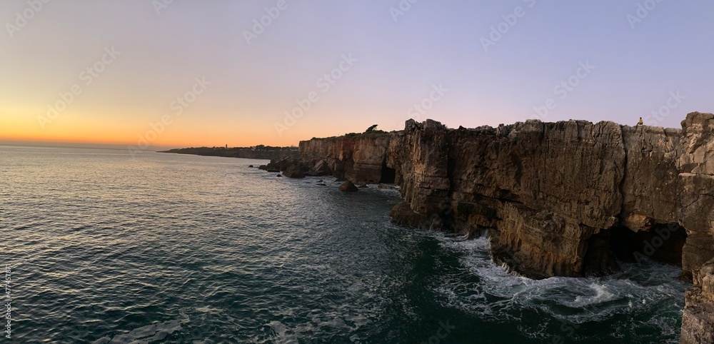 sunset over the ocean and cliffs at Boca do Lobo, Portugal