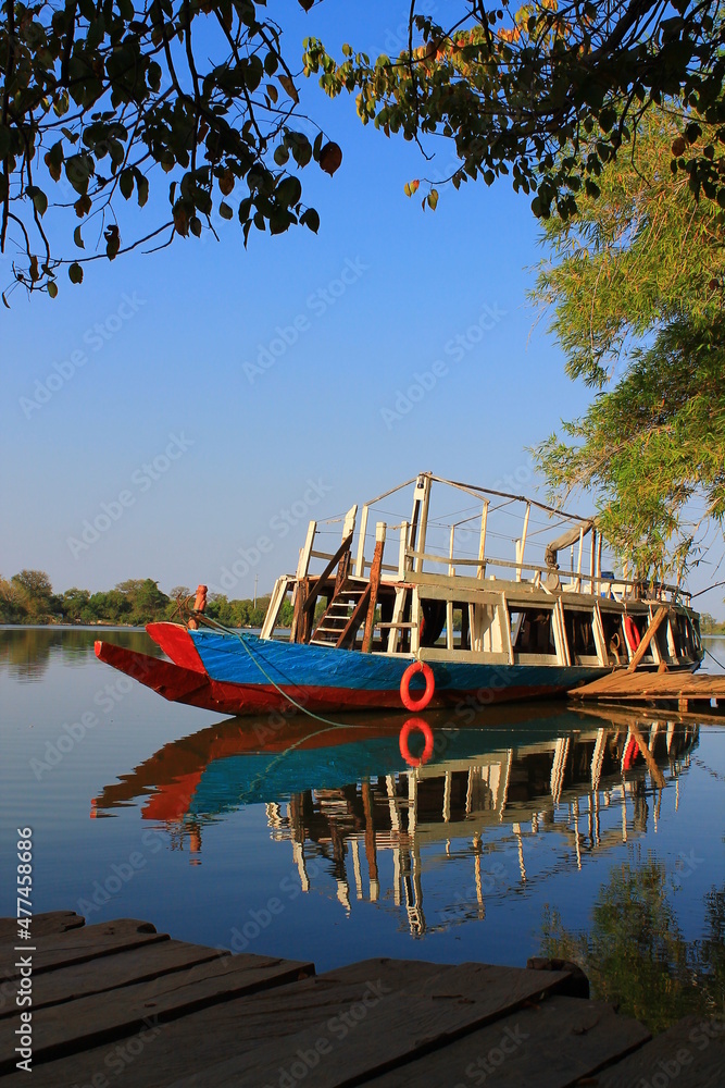 A riverboat on the Gambia river, in a portrait photo