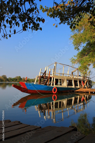 A riverboat on the Gambia river, in a portrait photo