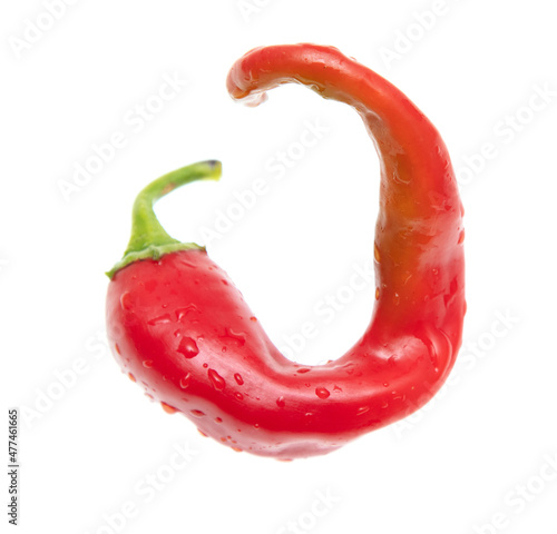 One red chili pepper isolated on a white background.