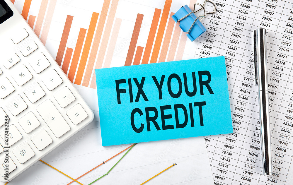 FIX YOUR CREDIT on sticker on chart background, business concept FIX YOUR CREDIT on sticker on chart background, business concept