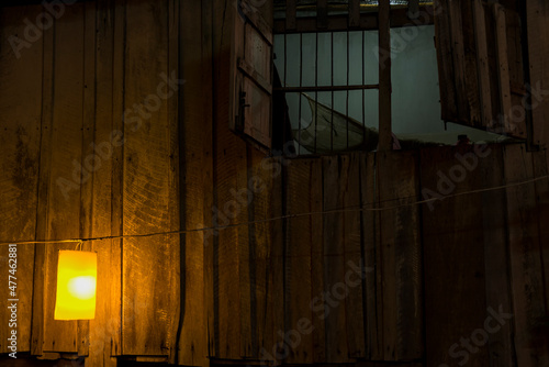 Wooden wall iluminated by lamp photo