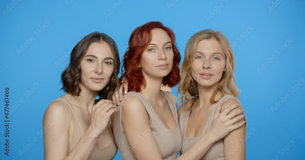 Blonde, redhead and dark haired woman are looking and smiling to the camera, portrait of different types of women in the blue screen, 4k 24p Prores Blonde, redhead and dark haired woman are looking and smiling to the camera, portrait of different types of women in the blue screen, 4k 24p Prores
