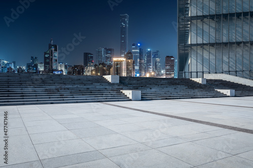 Panoramic skyline and modern commercial office buildings with empty square floors in Beijing at night