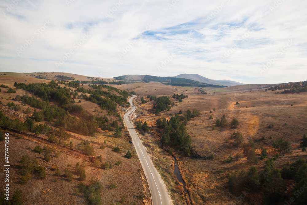 Nature landscape, rural road through autumn colors valley, beautiful nature landscape view of Serbia.