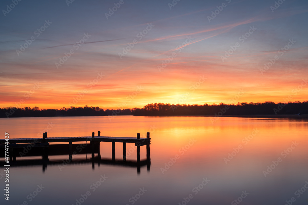 Cold and colorful dawn at a lake on a winters morning. Cold and colorful dawn at a lake on a winters morning.
