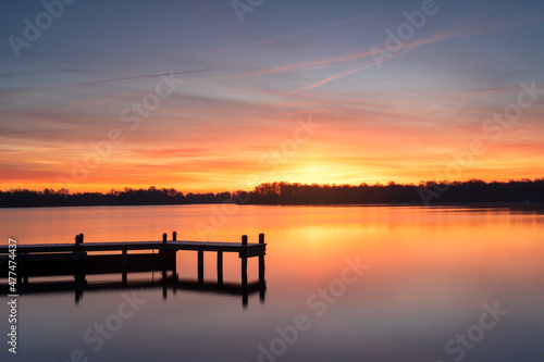 Cold and colorful dawn at a lake on a winters morning.