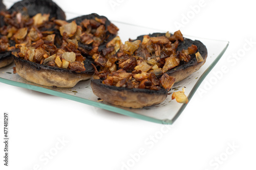 Mushrooms stuffed with garlic and onion, Spanish food. Isolated on white background. Selective focus.