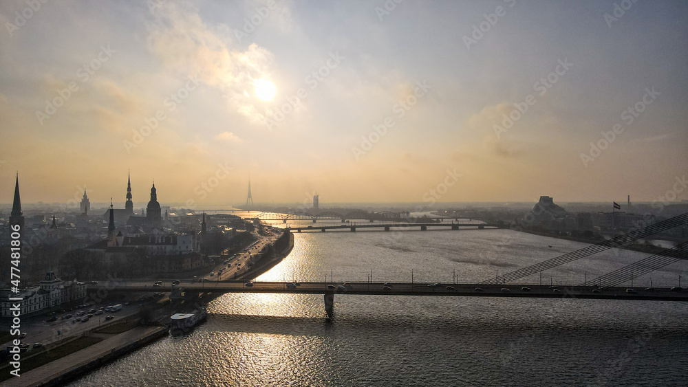 bridge and old town center in Riga at foggy morning