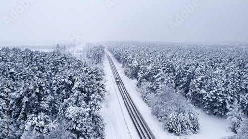 snow covered road in winter forest © OneLife_photography