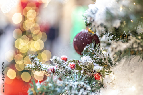 Christmas background of a Christmas tree decorated with Christmas toys.Winter holidays. New year