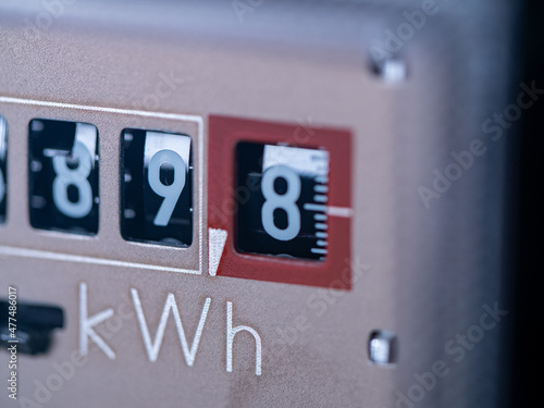 Close-up electricity meter. Measuring used electricity in kWh ( kilowatt hour ) photo